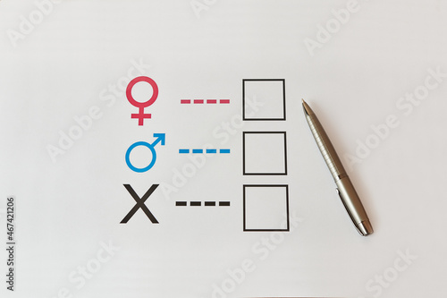 A person is determined by his gender. Sheet of paper with gender symbols. The right to one's identity.