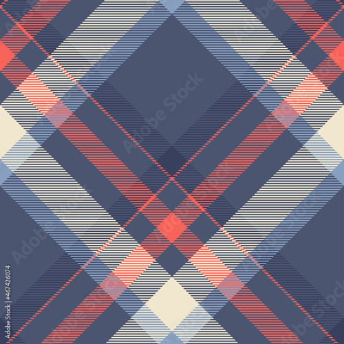 Seamless plaid pattern in blue, indigo, red and ivory cream. Diagonal repeat.