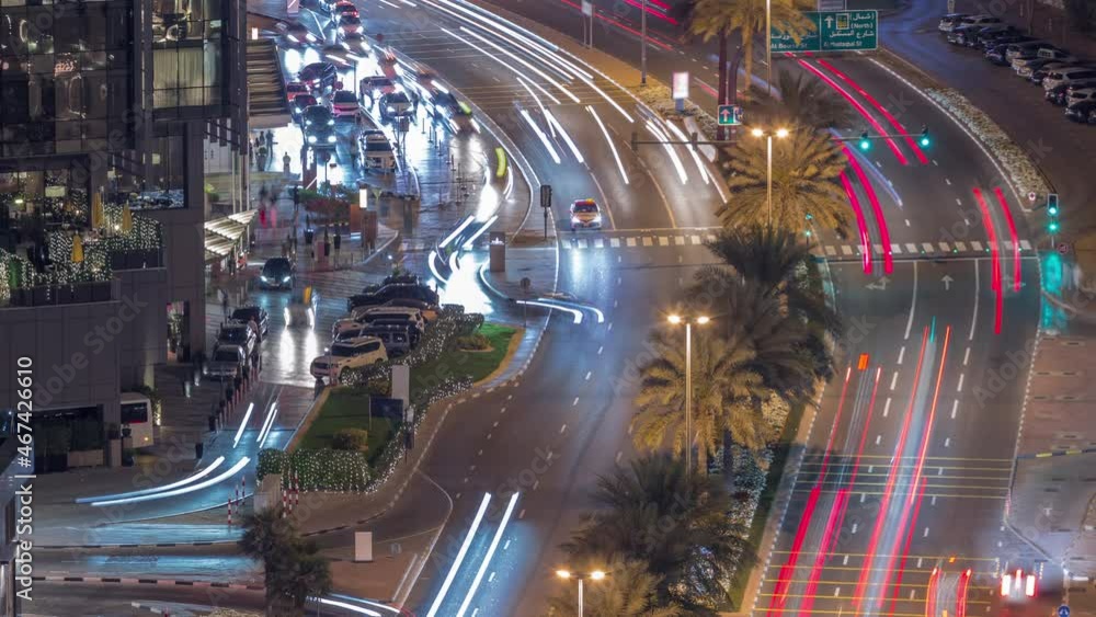 Skyline view of traffic on Al Saada street near DIFC district night timelapse in Dubai, UAE. Skyline view of traffic on Al Saada street near DIFC district night timelapse in Dubai, UAE.