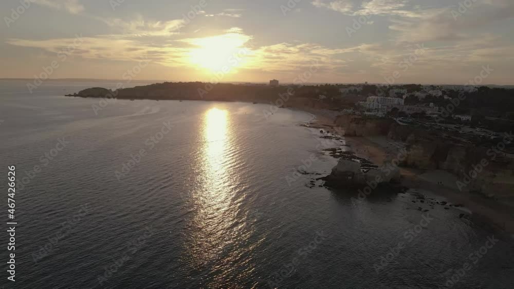 Aerial sunset view of beach Praia dos Careanos, in Portimao, western Algarve tourism destination region, Portugal. Aerial sunset view of beach Praia dos Careanos, in Portimao, western Algarve tourism destination region, Portugal.