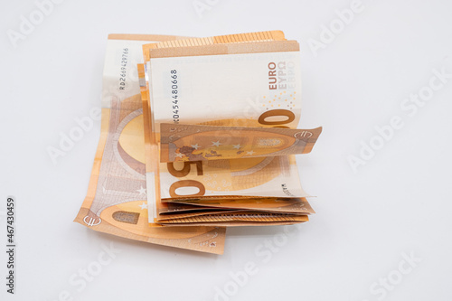 Several 50 euro banknotes folded on white background. 400 euros.