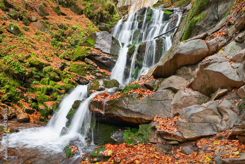 Autumn scenery with famous waterfall Shypit (Shypot) near Volovetz in Carpathian mountains, Ukraine photo