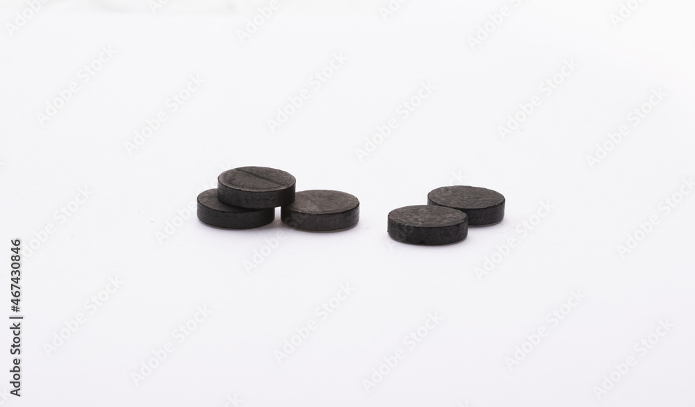 activated charcoal pills black on white background pills health adsorbent activated charcoal pills black on white background pills health adsorbent