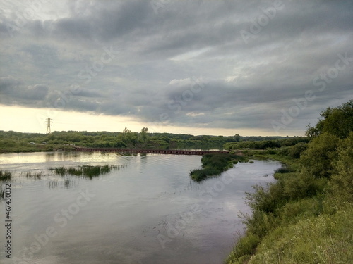 Fototapeta Naklejka Na Ścianę i Meble -  clouds over the river