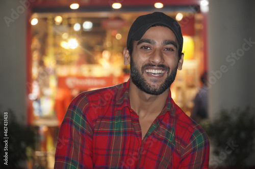 man with beautiful smile in night light