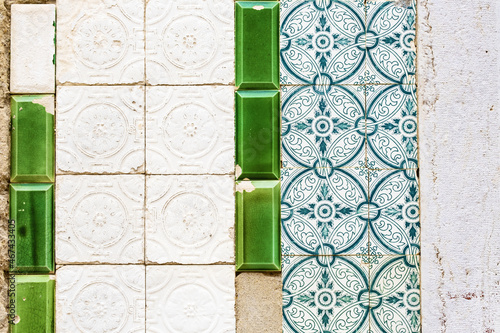 detail of facade covered with azulejos in Faro, Algarve, Portugal