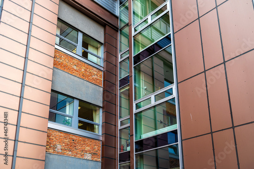 close-up angle of modern office building facade, geometric architectural vertical texture