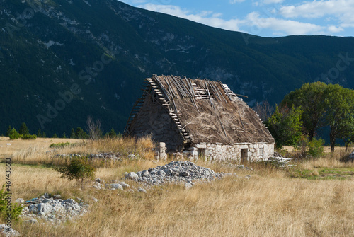Typical traditional mountain straw roof house of Balkans