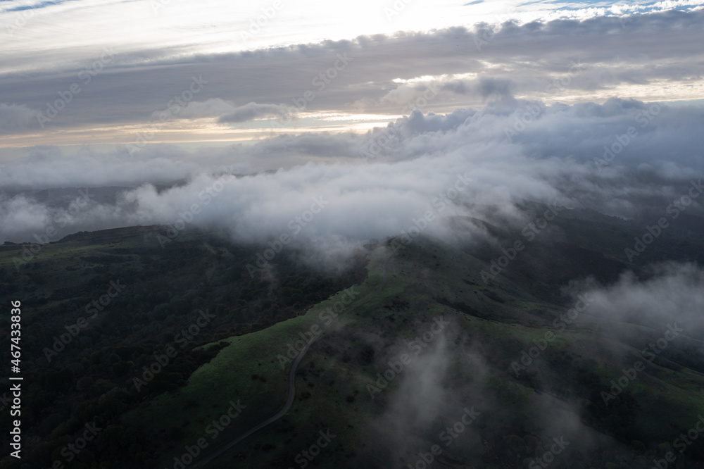 Low clouds drift across the rolling hills found east of San Francisco Bay, California. This dry region turns green during the winter months due to much needed rain.