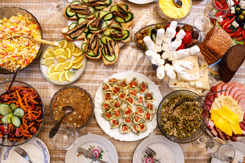 The dining table is filled with a variety of dishes.