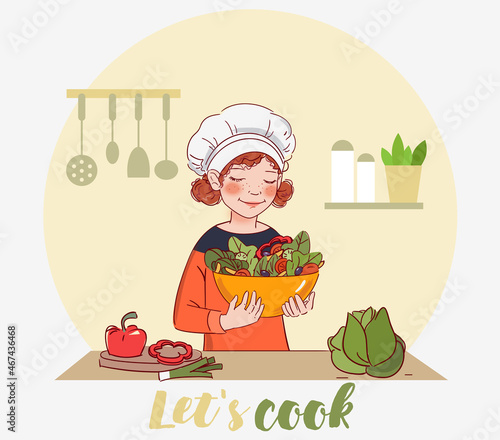 Cute girl cooking salad in the kitchen
