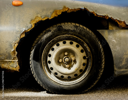 Принти на полотні old silver car wheel is of  gray   color. Rust. rusty car fender.
