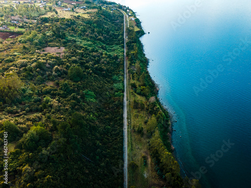 Aerial view of the rails of the city of puerto varas with part of the philippi hill and llanquihue lake.