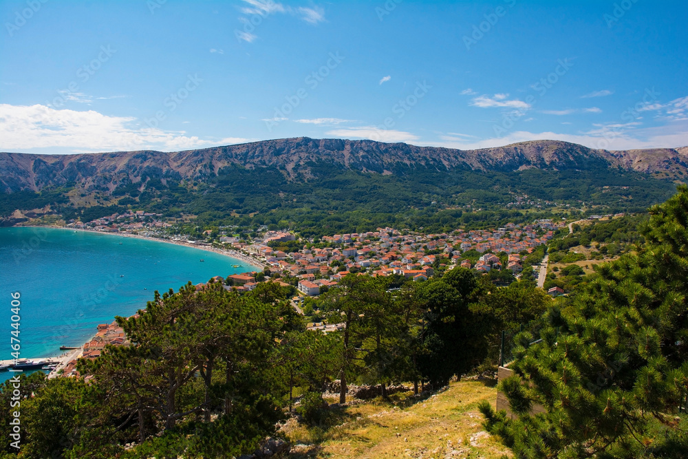 A view of Baska town and bay in the south of Krk Island, western Croatia. Taken from Baska Citadel on a hill overlooking the bay in late summer
