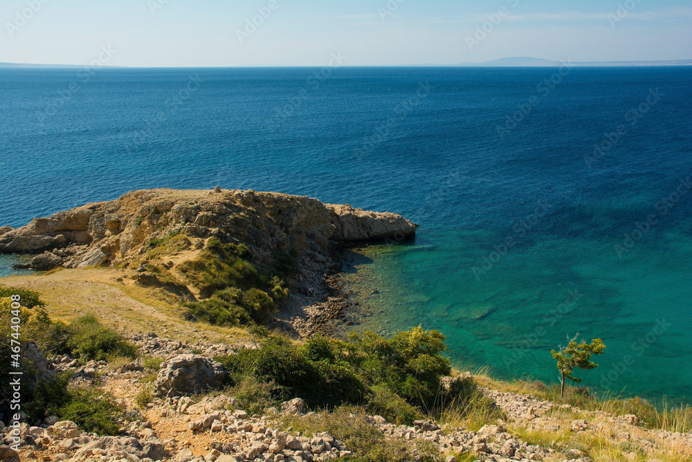 Fototapeta premium The rugged coastline north of Stara Baska in the south of Krk Island, in the Primorje-Gorski Kotar County of western Croatia in late summer 