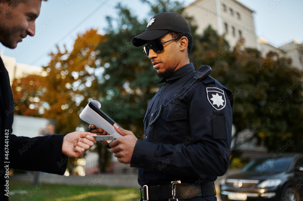 Police checking the driver's license from driver Police checking the driver's license from driver