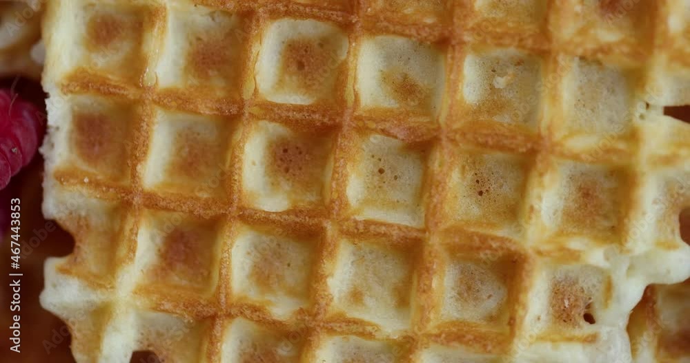Belgian waffles with fresh raspberries and blueberries. 4K Video Belgian waffles with fresh raspberries and blueberries. 4K Video
