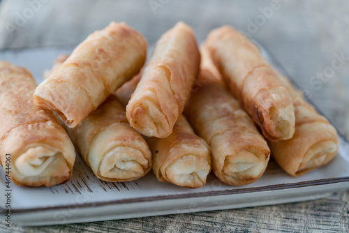 fried spring rolls made by phyllo dough on the table © berna_namoglu