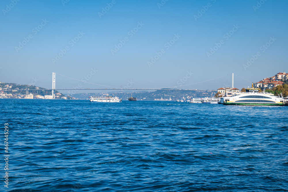 Bosphorus in Turkey, the Strait of Istanbul, view with the Bosphorus Bridge, known officially as the 15 July Martyrs Bridge in the background. Bosphorus in Turkey, the Strait of Istanbul, view with the Bosphorus Bridge, known officially as the 15 July Martyrs Bridge in the background.