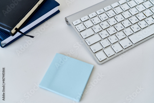wireless keyboard on desktop cup documents office