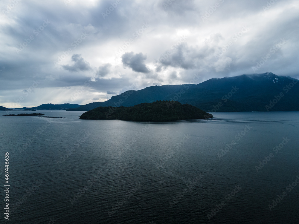 Aerial view of cabras island with a cloudy background near hornopiren