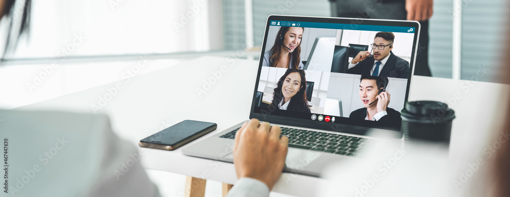 Business people in video call meeting proficiently discuss business plan in office and virual workplace . Telework conference call using smart video technology to communicate colleague . - obrazy, fototapety, plakaty 