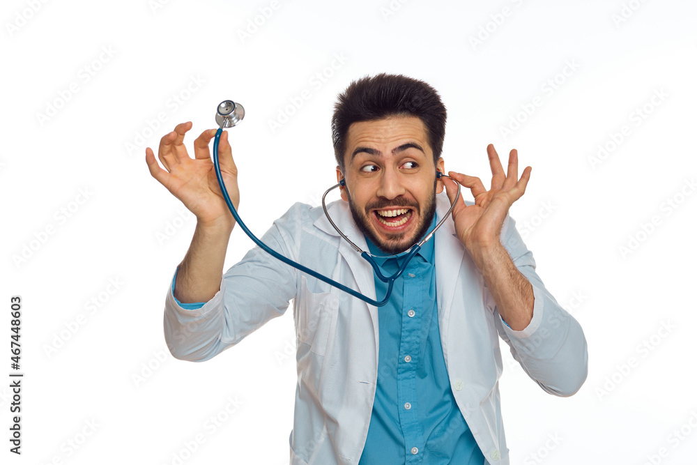 Fototapeta premium male doctor otoscope hospital treatment therapist light background