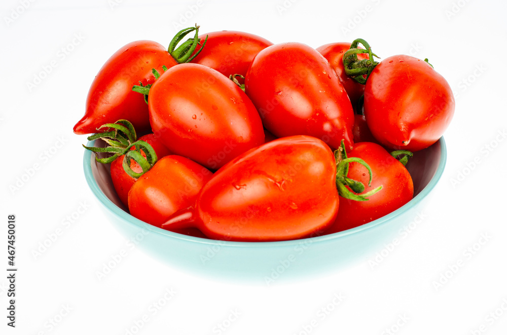 Red ripe oval tomatoes. Studio Photo. Red ripe oval tomatoes. Studio Photo.