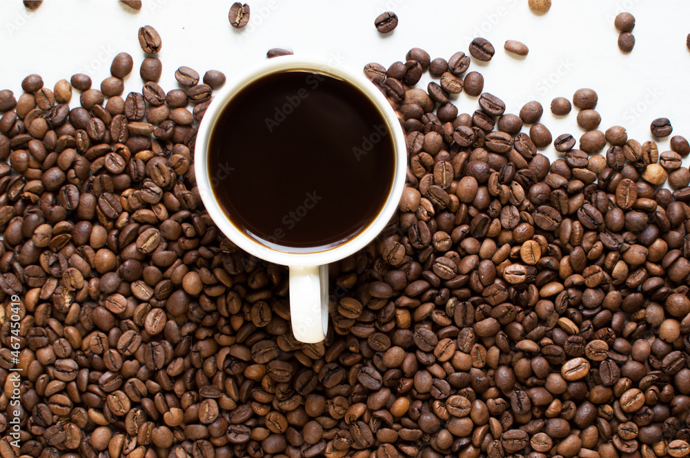 cup of aromatic coffee on a white background and scattered coffee grains. good morning . kind of sveru. flat lay. place for text. coffee time.
cup of aromatic coffee on a white background and scattered coffee grains. good morning . kind of sveru. flat lay. place for text. coffee time.