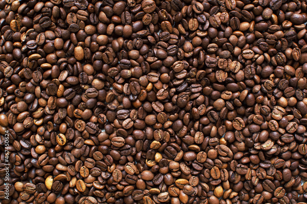 roasted aromatic coffee beans on a dark background. coffee background. flat lay with place for text. view from above.
roasted aromatic coffee beans on a dark background. coffee background. flat lay with place for text. view from above.