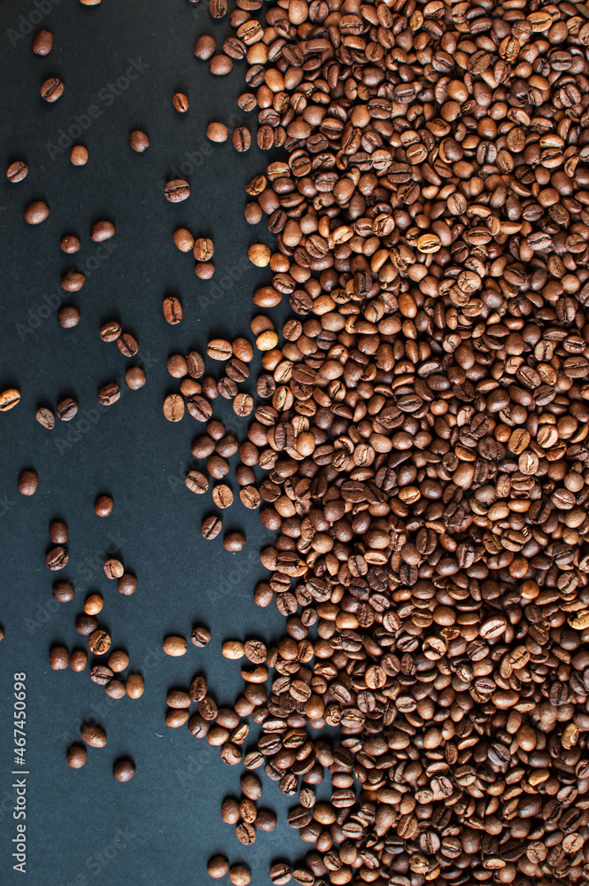 roasted aromatic coffee beans on a dark background. coffee background. flat lay with place for text. view from above.
roasted aromatic coffee beans on a dark background. coffee background. flat lay with place for text. view from above.