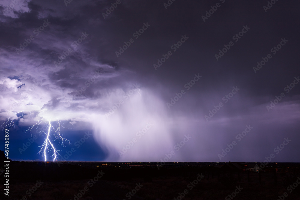 Naklejka premium Lightning storm over the city in Santa Fe, New Mexico