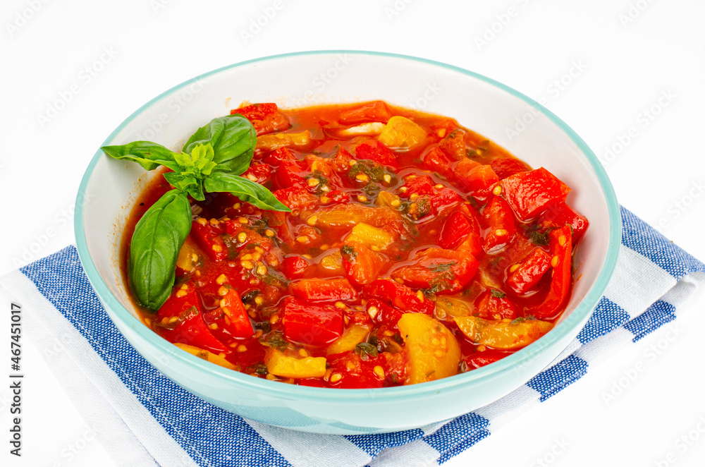 Vegetable dish of stewed sweet peppers and tomatoes, lecho, vegetarian menu. Studio Photo. Vegetable dish of stewed sweet peppers and tomatoes, lecho, vegetarian menu. Studio Photo.