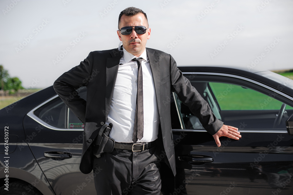 Professional male spy agent bodyguard with gun. Security police protection Professional male spy agent bodyguard with gun. Security police protection