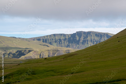 Grassy landscape with mountains and meadow near the Black Sand Beach Vik South Iceland