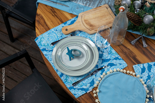tableware with christmas decoration mounted for christmas dinner smile a wooden table