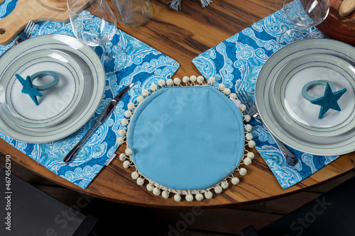 blue tortillero with christmas decoration on a table for christmas dinner
