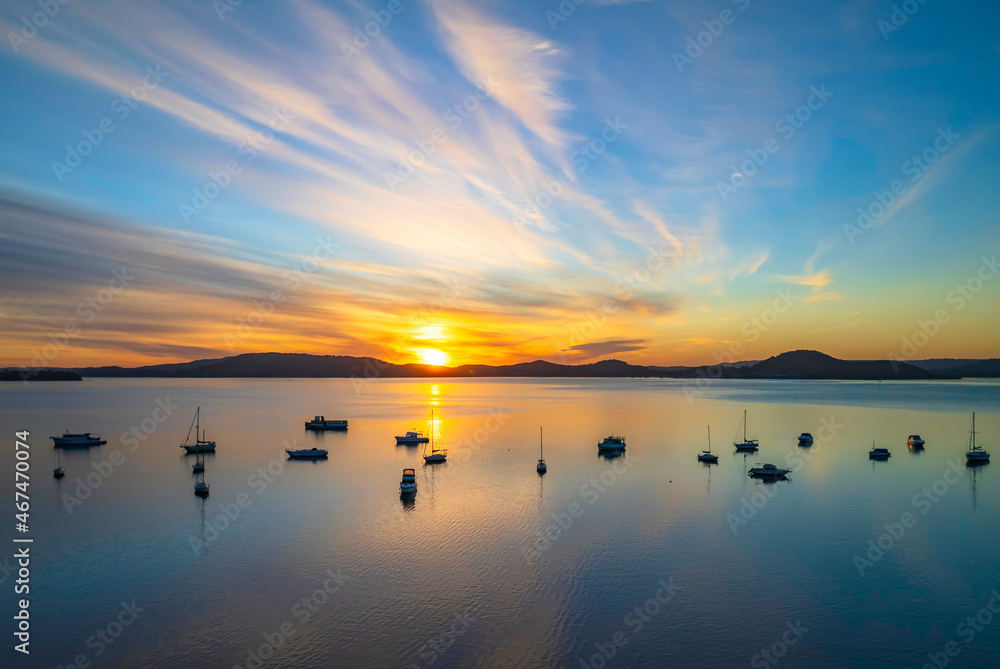 Aerial sunrise waterscape with boats and high cloud Aerial sunrise waterscape with boats and high cloud