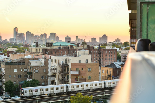 Train leaving station in Brooklyn NYC during sunset. photo