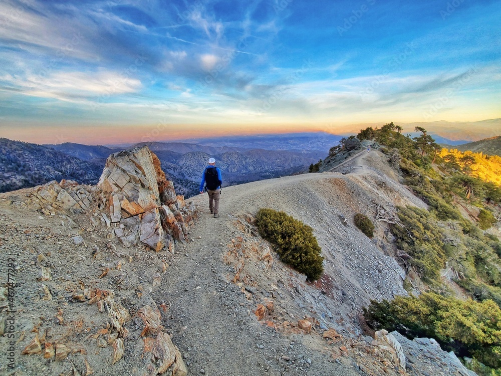 Mount Baldy Summit Trail, California, USA  October 20, 2021: a man hiking at the Devils Backbone in California