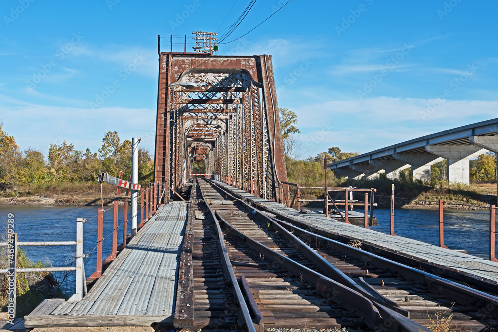 The beautiful Through Truss swing railroad bridge crosses the Missouri River at Atchison, Kansas. The beautiful Through Truss swing railroad bridge crosses the Missouri River at Atchison, Kansas.