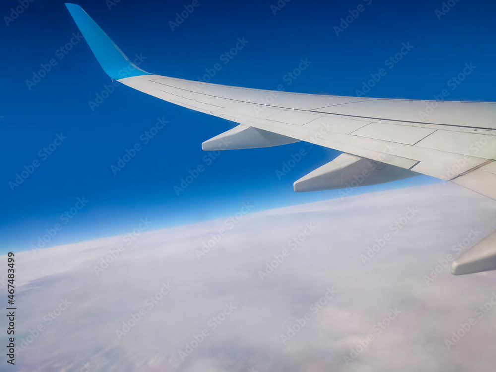 View from an airplane on a blue sky and white clouds. View from an airplane on a blue sky and white clouds.