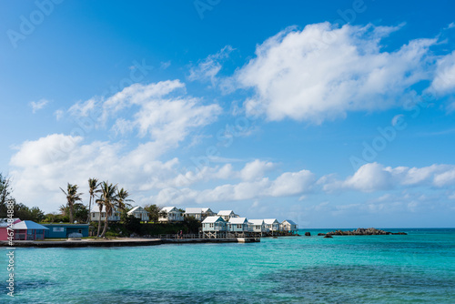 Bermuda's Coastal Symphony: Where azure waters meet vibrant skies, lush landscapes cradle charming houses, creating a harmonious island masterpiece. © Ning