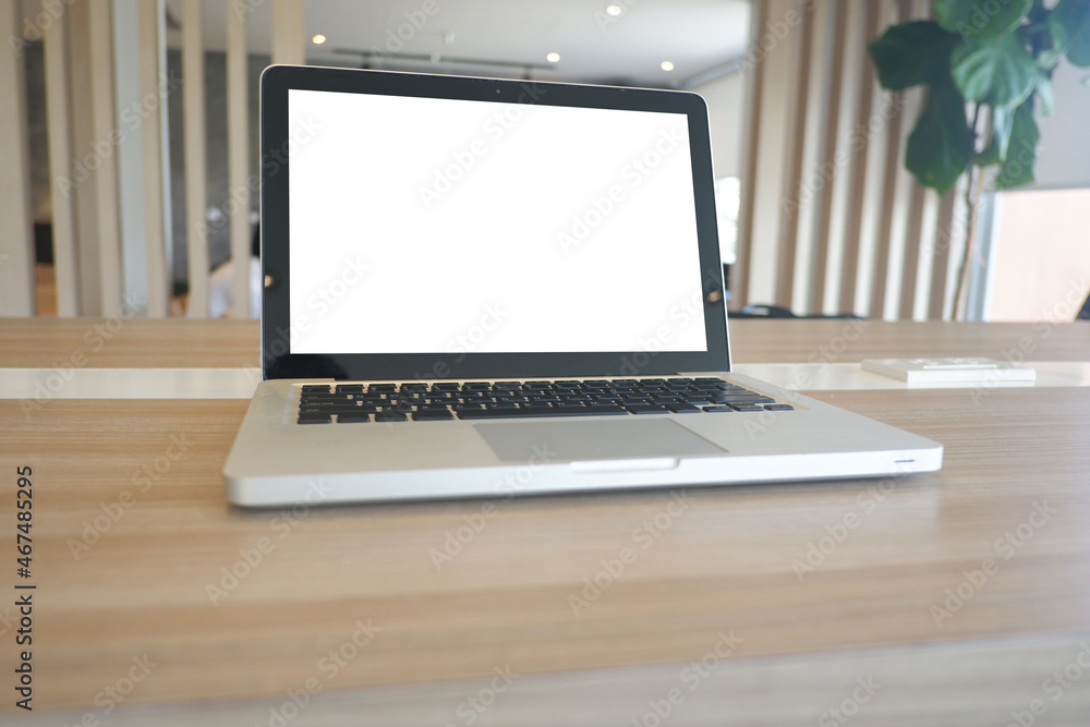 Fototapeta premium Cropped shot view of wood office desk table with office equipments, and other office supplies on the modern space, flat lay
