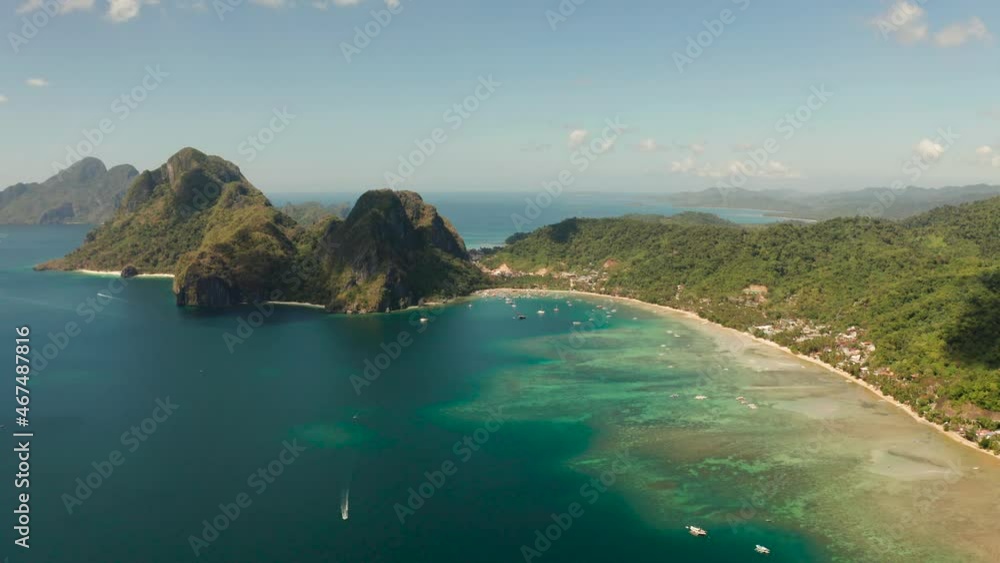 Aerial view bay with lagoon and turquoise water on a tropical island against the backdrop of the mountains. Corong corong beach, El Nido, Palawan, Philippines. Summer and travel vacation concept Aerial view bay with lagoon and turquoise water on a tropical island against the backdrop of the mountains. Corong corong beach, El Nido, Palawan, Philippines. Summer and travel vacation concept