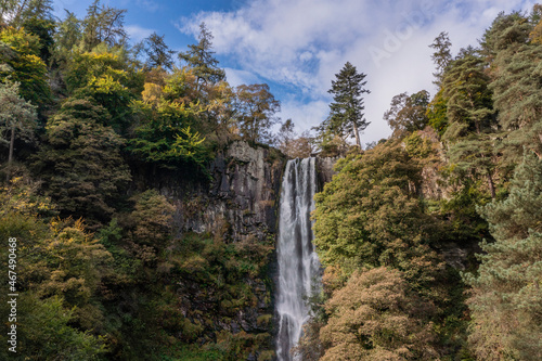 Aerial flying drone bird's eye view Beautiful long exposure landscape early Autumn image of Pistyll Rhaeader waterfall in Wales