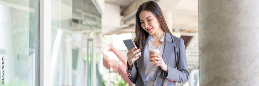 Working woman concept a young female manager attending video conference and holding a cup of coffee Working woman concept a young female manager attending video conference and holding a cup of coffee