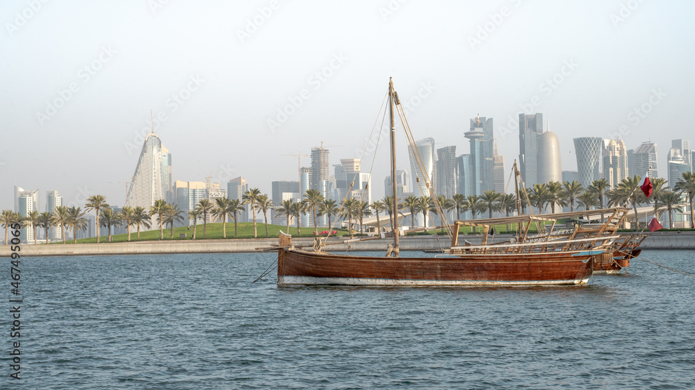 Qatar skyline along with a qatar traditional dhow. selective focus