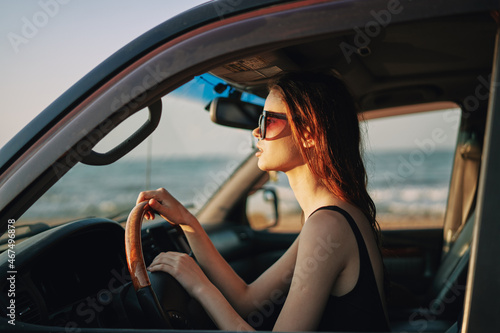 pretty woman in sunglasses driving a car trip © VICHIZH