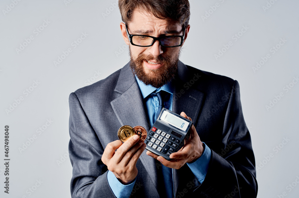 emotional man calculator bitcoin in hand counting finance studio official emotional man calculator bitcoin in hand counting finance studio official